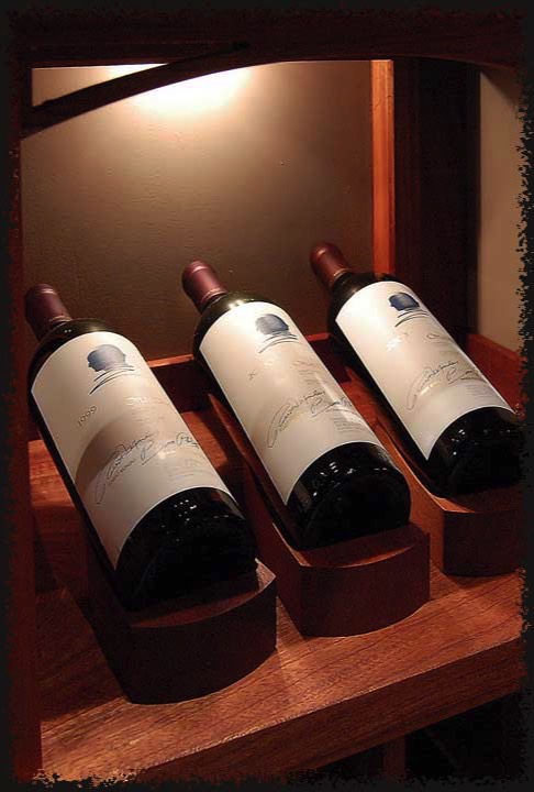 Backlit display shelves hold a variety of items, like this vertical of Opus One, which can be changed periodically.