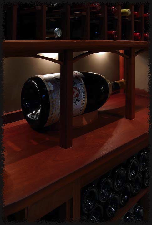 A six liter Chateauneuf-du-Pape is displayed along one of the display shelves. 