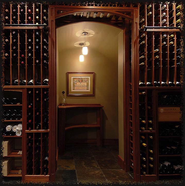 A custom arched corner table provides both function and interest while still allowing space to pass by.  This interior alcove is actually the space under a staircase.