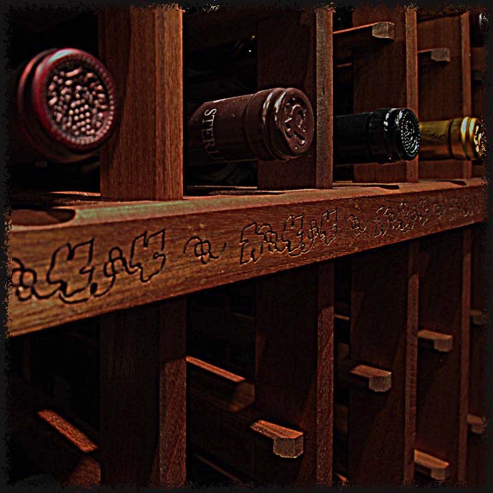 A simple grape leaf motif surrounds the cellar on each horizontal millwork member.