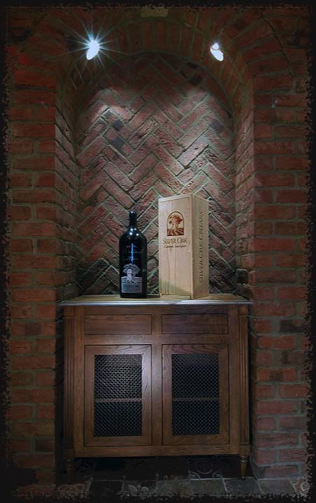 A custom-made solid oak cabinet—designed with the client—was made to fit in a niche in the rear wall of the room.