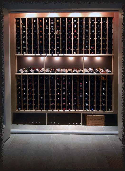Brightly lit, this wine closet provides useful storage and aesthetic interest to the lower level of the home.