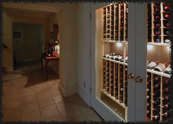 A dormant closet was converted to a wine closet using maple wood to complement the light colors surrounding the room.