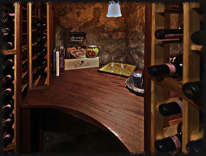 A solid sapele work surface in a corner of the room was carefully scribed to fit against the stone wall surface without gaps.