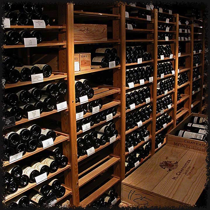 The shelves can be moved at any time to accomodate various formats or case sizes. <br> <br> The cellar was designed with a roller ramp from the outside to load inventory (not shown) which required a wider aisle.  The extra aisle space also holds stacked cases.